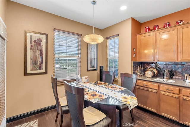 dining space with dark wood finished floors