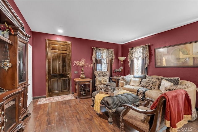 living room featuring baseboards and wood finished floors