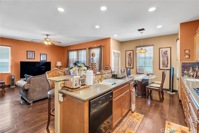 kitchen with dishwasher, dark wood-style floors, open floor plan, a sink, and recessed lighting