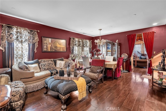 living area with a chandelier and hardwood / wood-style flooring