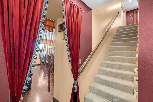 stairway with wood finished floors