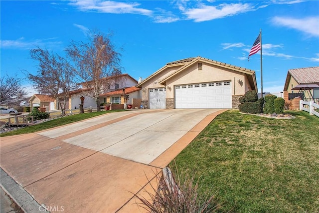 mediterranean / spanish-style house with a garage, concrete driveway, stone siding, a front lawn, and stucco siding