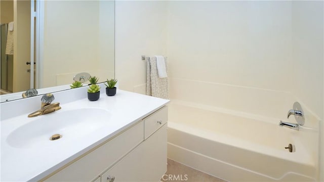 full bath with a bathtub and vanity