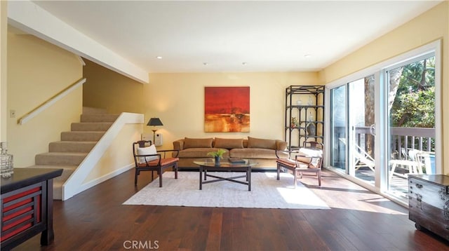 living room with stairway, wood finished floors, and recessed lighting