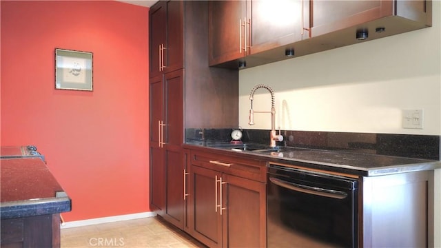 kitchen with a sink, baseboards, dark stone counters, and dishwasher