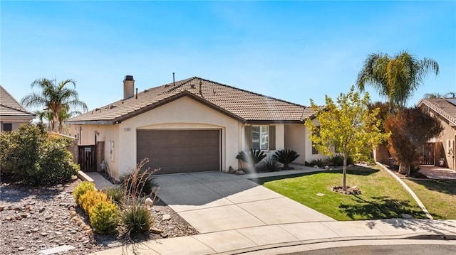 ranch-style house featuring stucco siding, a garage, driveway, a tiled roof, and a front lawn