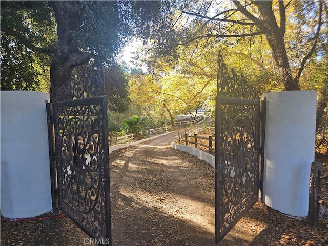 view of gate with fence