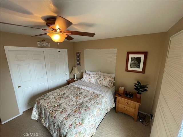 carpeted bedroom with a closet and ceiling fan