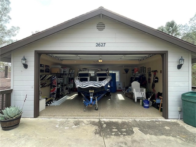 garage with concrete driveway