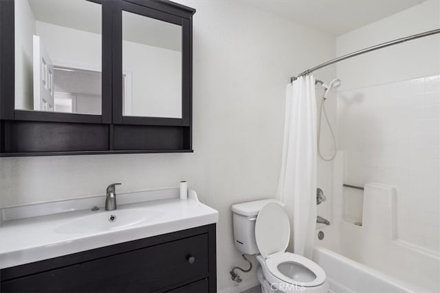 bathroom featuring shower / tub combo with curtain, vanity, and toilet