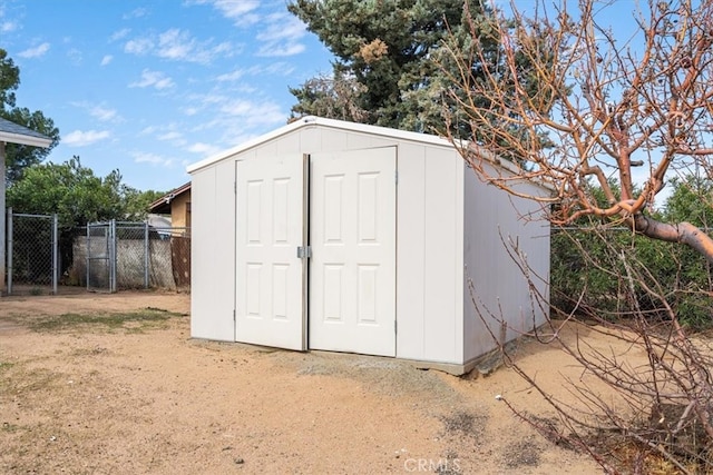 view of shed with fence