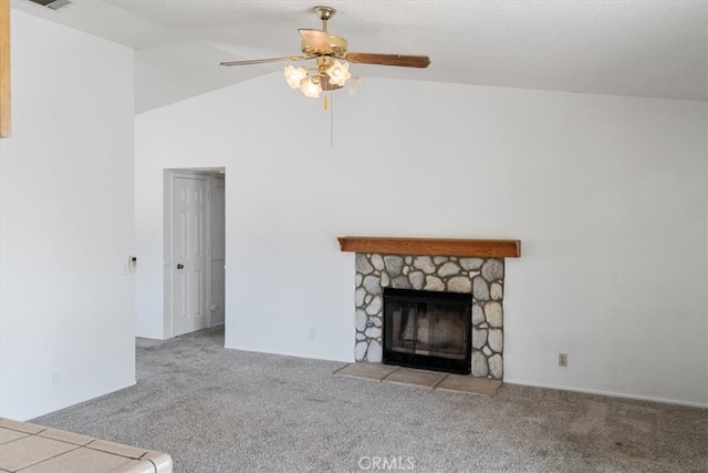 unfurnished living room with carpet floors, a fireplace, visible vents, vaulted ceiling, and ceiling fan