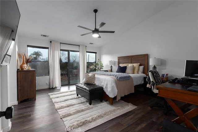 bedroom featuring lofted ceiling, access to exterior, dark wood-style floors, and visible vents