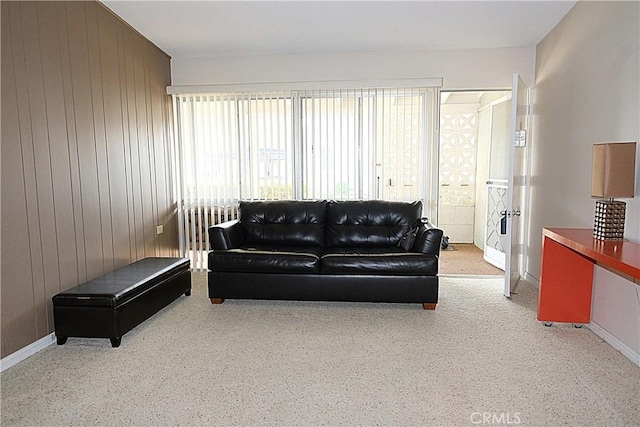 living room with wood walls and radiator heating unit