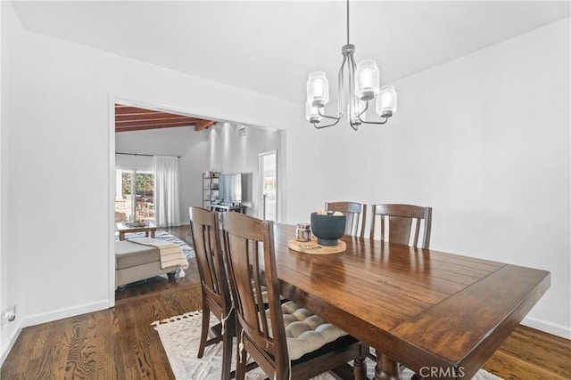 dining area with baseboards, lofted ceiling with beams, an inviting chandelier, and wood finished floors