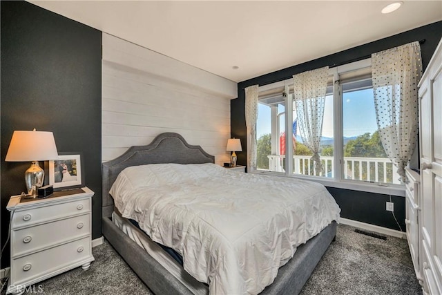 bedroom featuring carpet flooring, visible vents, and baseboards