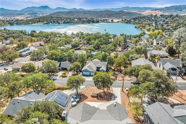 drone / aerial view with a residential view and a water and mountain view