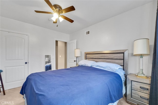 bedroom featuring visible vents, a ceiling fan, and carpet flooring