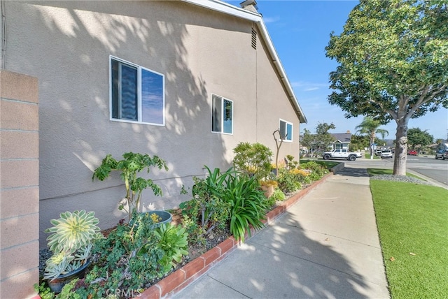 view of property exterior with stucco siding