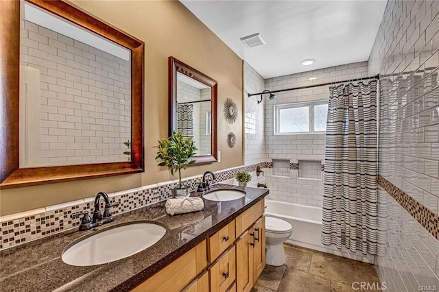 full bathroom with toilet, a sink, visible vents, and shower / bathtub combination with curtain