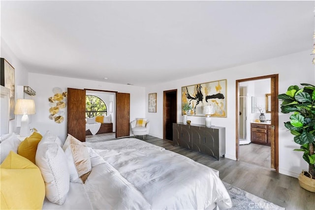 bedroom featuring wood finished floors