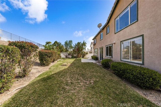 view of yard with a patio area and a fenced backyard