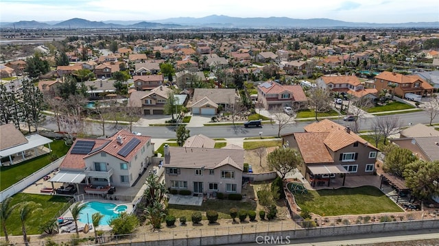 drone / aerial view featuring a mountain view and a residential view