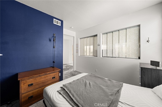 bedroom featuring carpet and visible vents