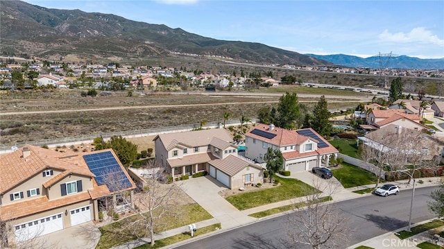 drone / aerial view with a residential view and a mountain view