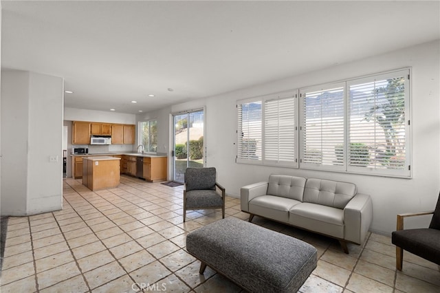 living area with recessed lighting and light tile patterned floors