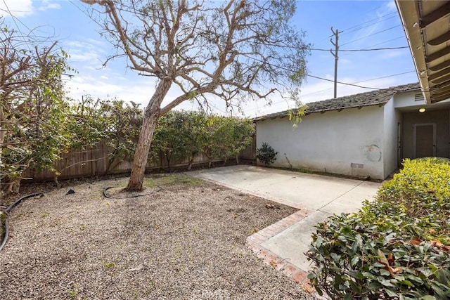 view of yard with a patio area and fence