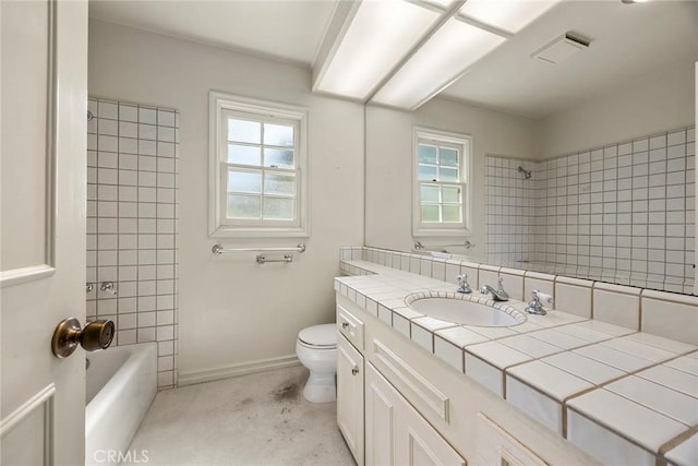 full bath featuring toilet, baseboards, tub / shower combination, and vanity