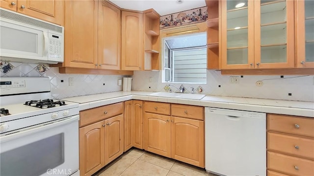 kitchen with light tile patterned floors, white appliances, a sink, decorative backsplash, and open shelves