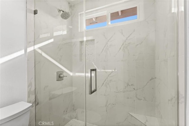full bath with toilet and a marble finish shower