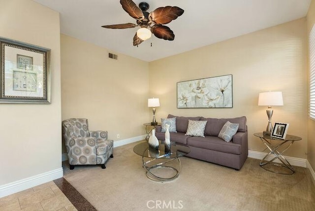 carpeted living area with visible vents, ceiling fan, and baseboards