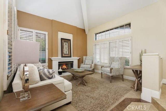 living area featuring a fireplace, carpet flooring, high vaulted ceiling, beamed ceiling, and baseboards