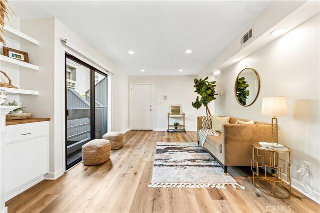 12564 Montecito Rd Unit 4, Seal Beach, CA 90740 - living room with light wood-type flooring and recessed lighting