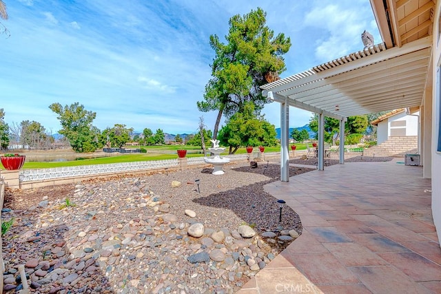 view of yard with a pergola and a patio