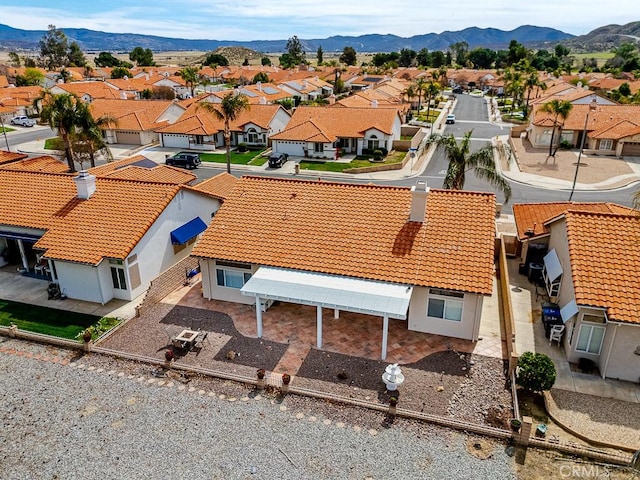 birds eye view of property with a residential view and a mountain view