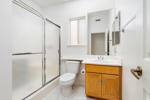 bathroom featuring visible vents, a stall shower, tile patterned flooring, and toilet