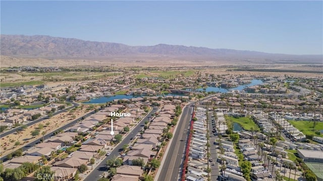 birds eye view of property with a residential view and a water and mountain view