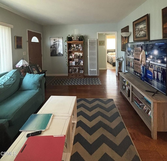 living area with dark wood-style floors and baseboards