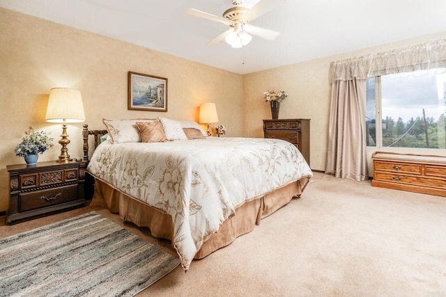 carpeted bedroom with a ceiling fan