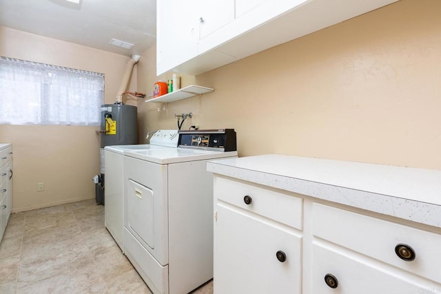 laundry room featuring cabinet space, water heater, visible vents, and washer and dryer