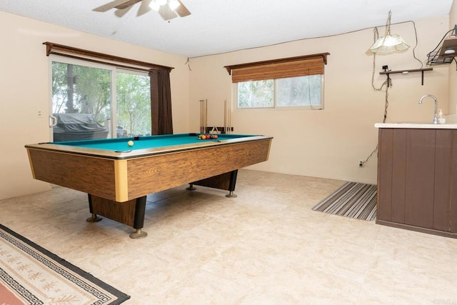 game room featuring ceiling fan, pool table, and a sink