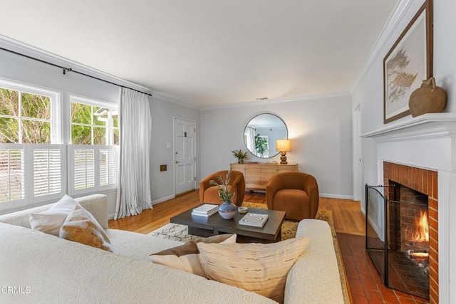 living room featuring a brick fireplace, baseboards, and ornamental molding