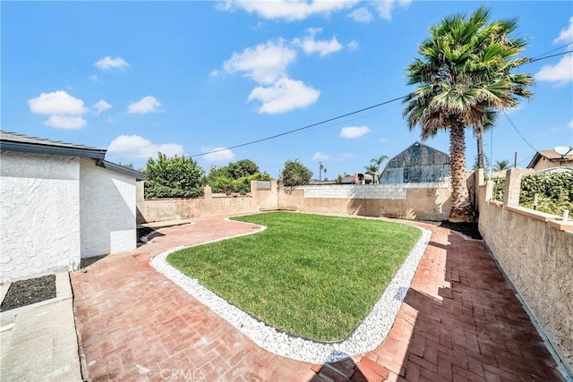 view of yard featuring a fenced backyard and a patio