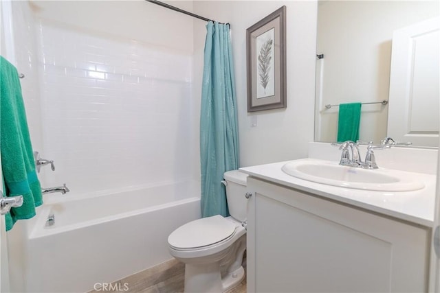 bathroom featuring shower / tub combo with curtain, vanity, and toilet