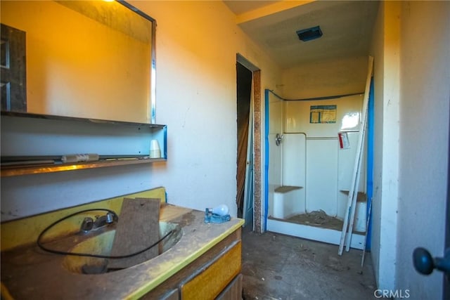 bathroom featuring concrete floors and vanity