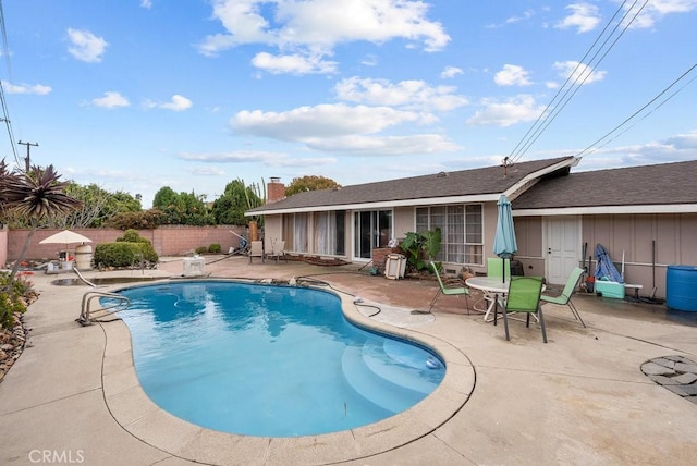 view of swimming pool featuring a fenced in pool, a fenced backyard, and a patio area